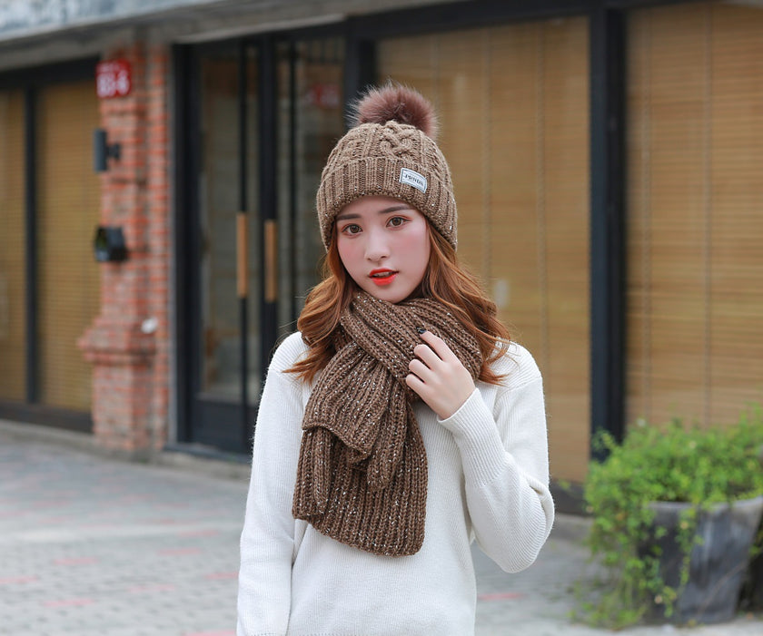 Women knitting wool hat and long scarf