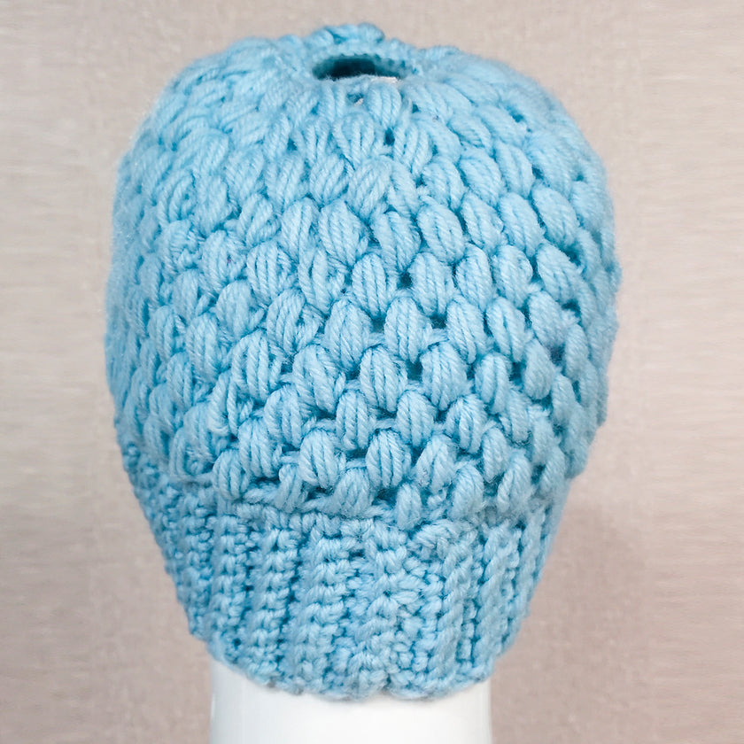 Europe and the United States new knit hat winter ladies horsetail hat autumn and winter earmuffs wool hat fashion labeling empty top hat