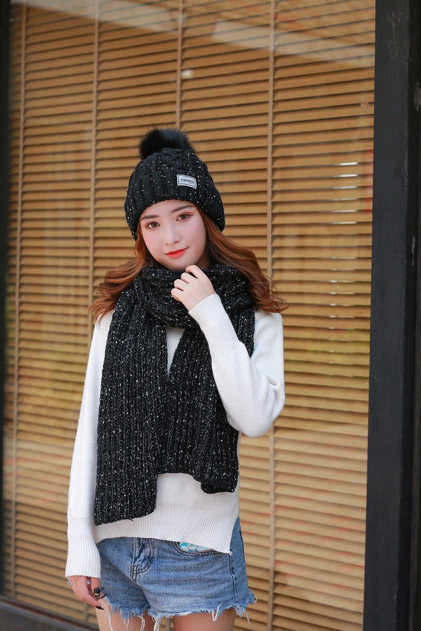 Women knitting wool hat and long scarf