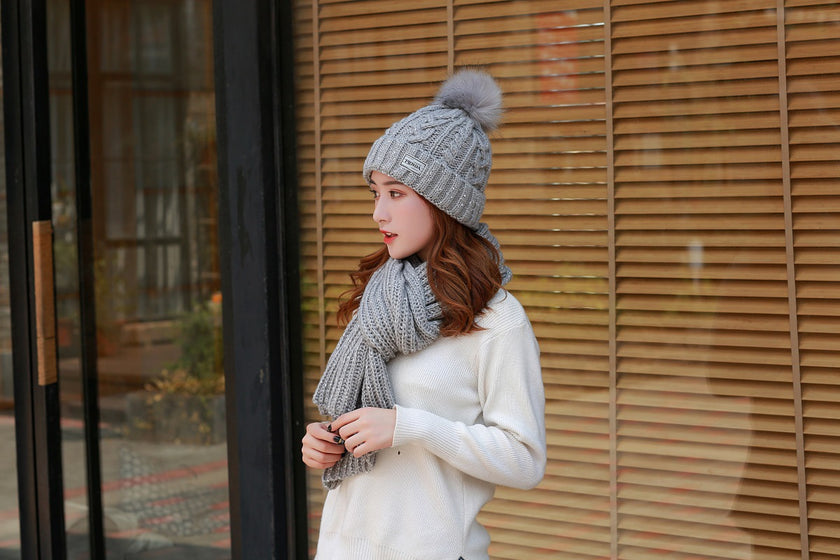 Women knitting wool hat and long scarf