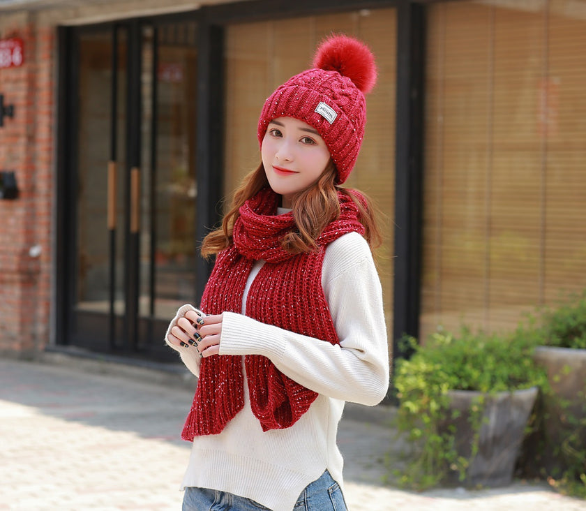 Women knitting wool hat and long scarf