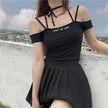Pleated skirt with letter straps