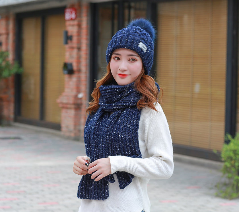 Women knitting wool hat and long scarf