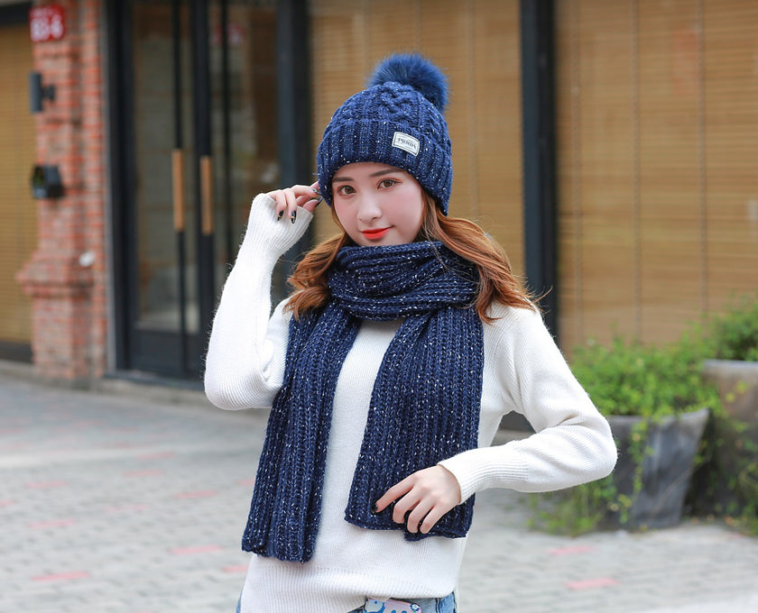 Women knitting wool hat and long scarf