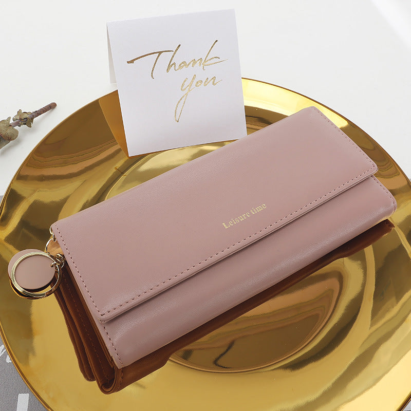 Women's hand holding wallet female long section 2021 new Japanese and Korean personality pendant multi-function student wallet