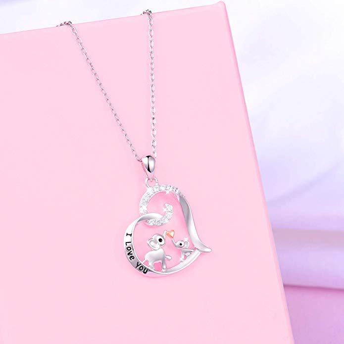 Baby elephant kisses the necklace