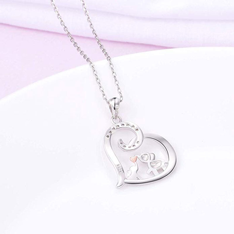 Baby elephant kisses the necklace