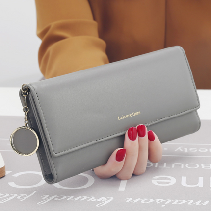 Women's hand holding wallet female long section 2021 new Japanese and Korean personality pendant multi-function student wallet