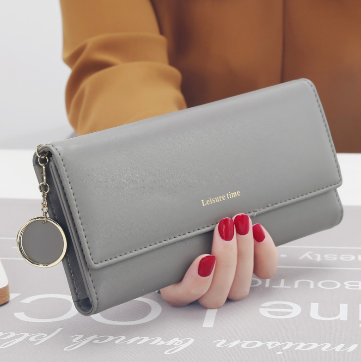 Women's hand holding wallet female long section 2021 new Japanese and Korean personality pendant multi-function student wallet