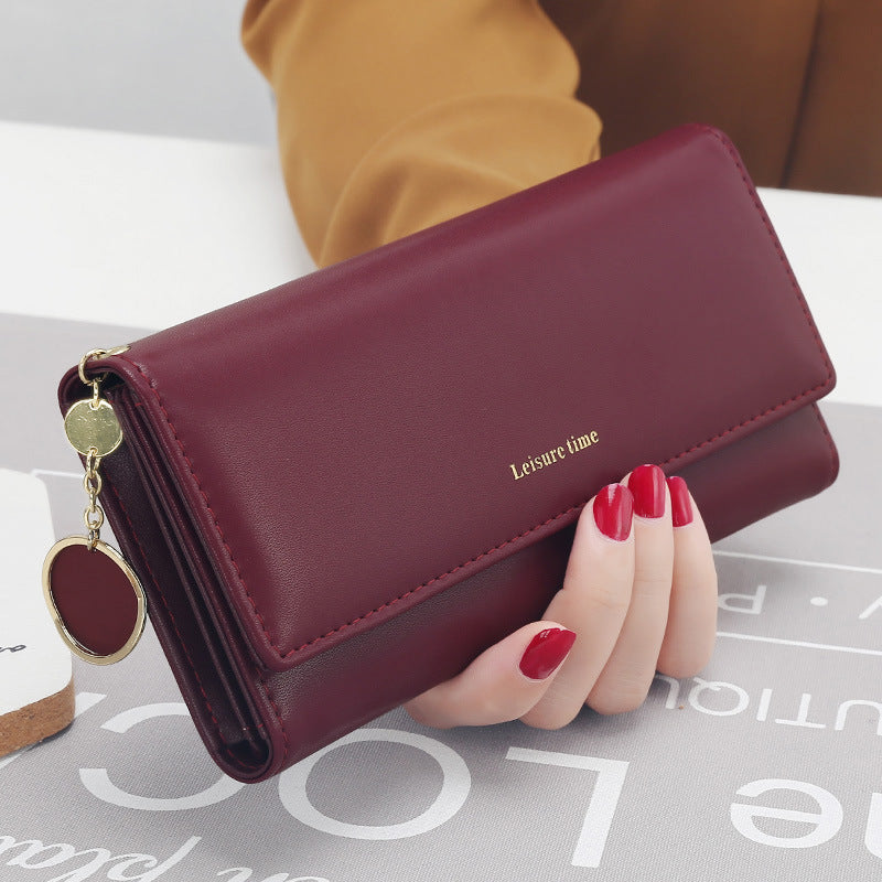 Women's hand holding wallet female long section 2021 new Japanese and Korean personality pendant multi-function student wallet
