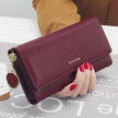 Women's hand holding wallet female long section 2021 new Japanese and Korean personality pendant multi-function student wallet