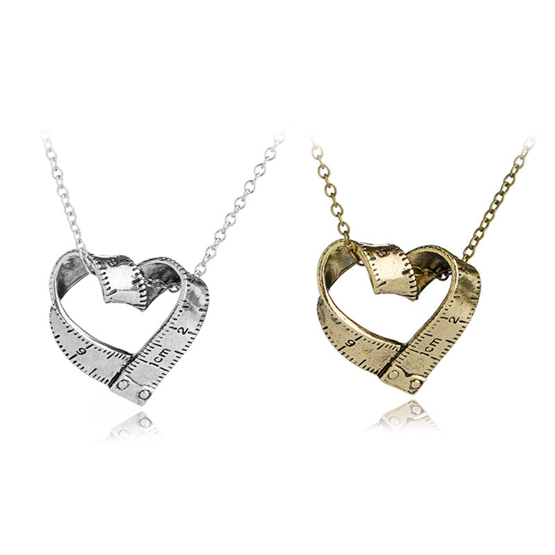 Heart-shaped rotating tape measure necklace