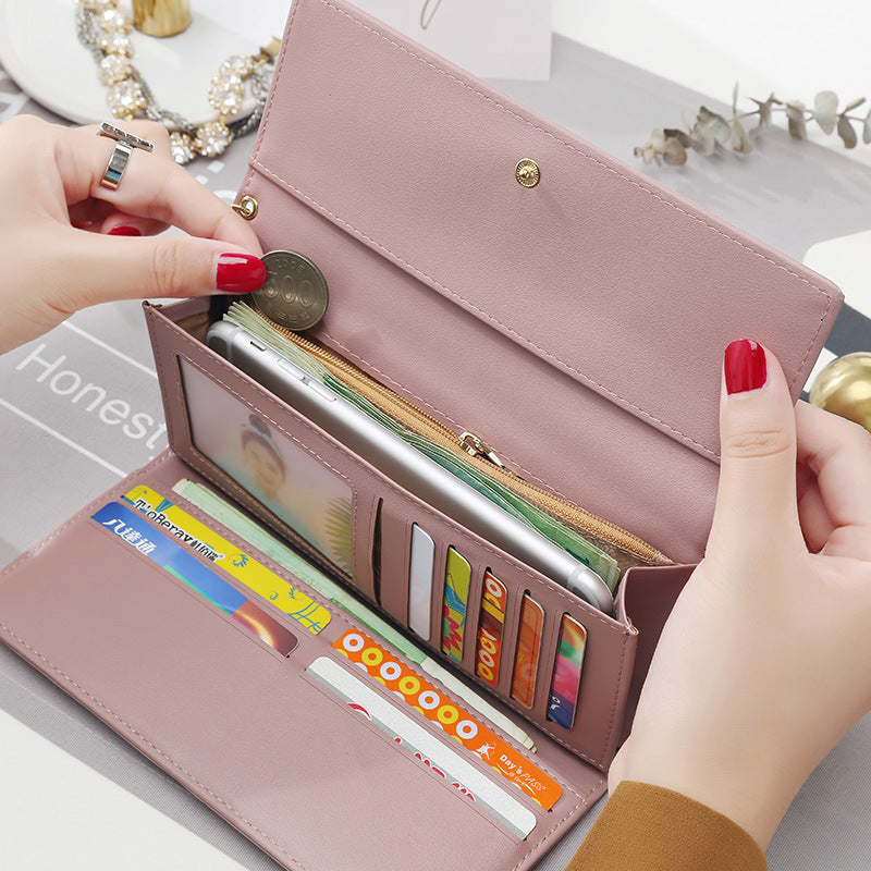 Women's hand holding wallet female long section 2021 new Japanese and Korean personality pendant multi-function student wallet