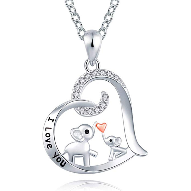 Baby elephant kisses the necklace