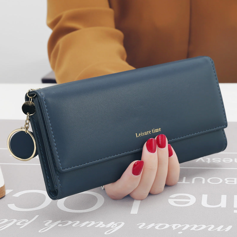 Women's hand holding wallet female long section 2021 new Japanese and Korean personality pendant multi-function student wallet