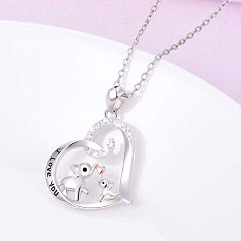 Baby elephant kisses the necklace